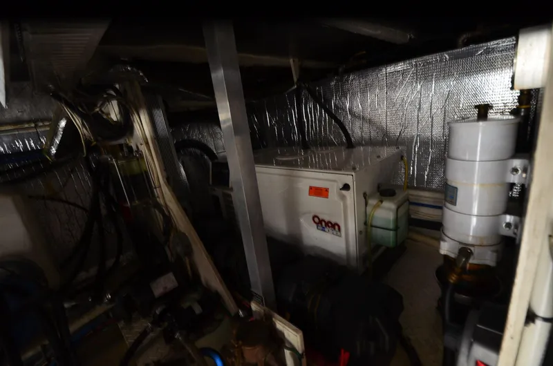 Tenacious Yacht Photos Pics Engine room of 2003 Cruisers Yachts 5000 Sedan Sport with Onan generator.