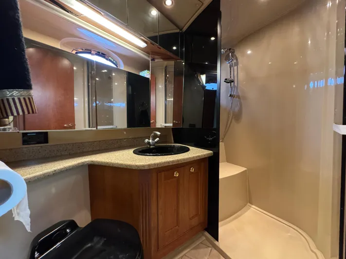 Tenacious Yacht Photos Pics Luxurious bathroom in 2003 Cruisers Yachts 5000 Sedan Sport with modern fixtures and shower.