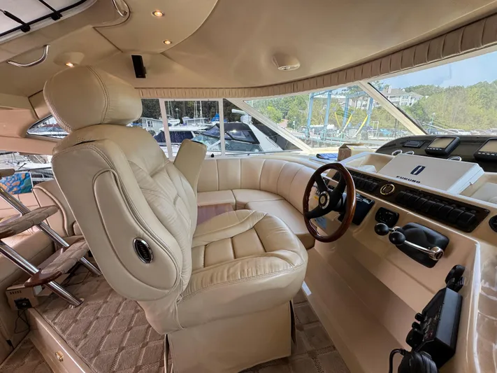 Tenacious Yacht Photos Pics Luxurious interior of 2003 Cruisers Yachts 5000 Sedan Sport with leather seating and modern controls.