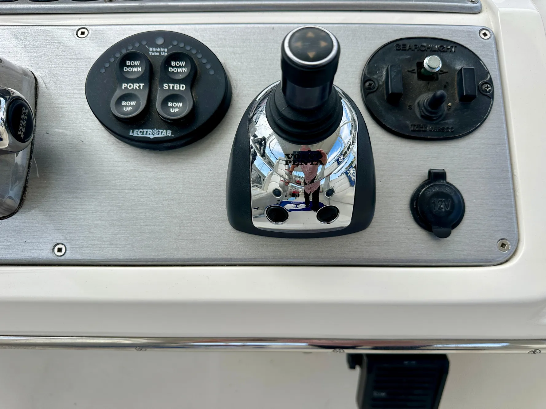 Control panel of a 2008 Carver 43 Super Sport boat with joystick and buttons.