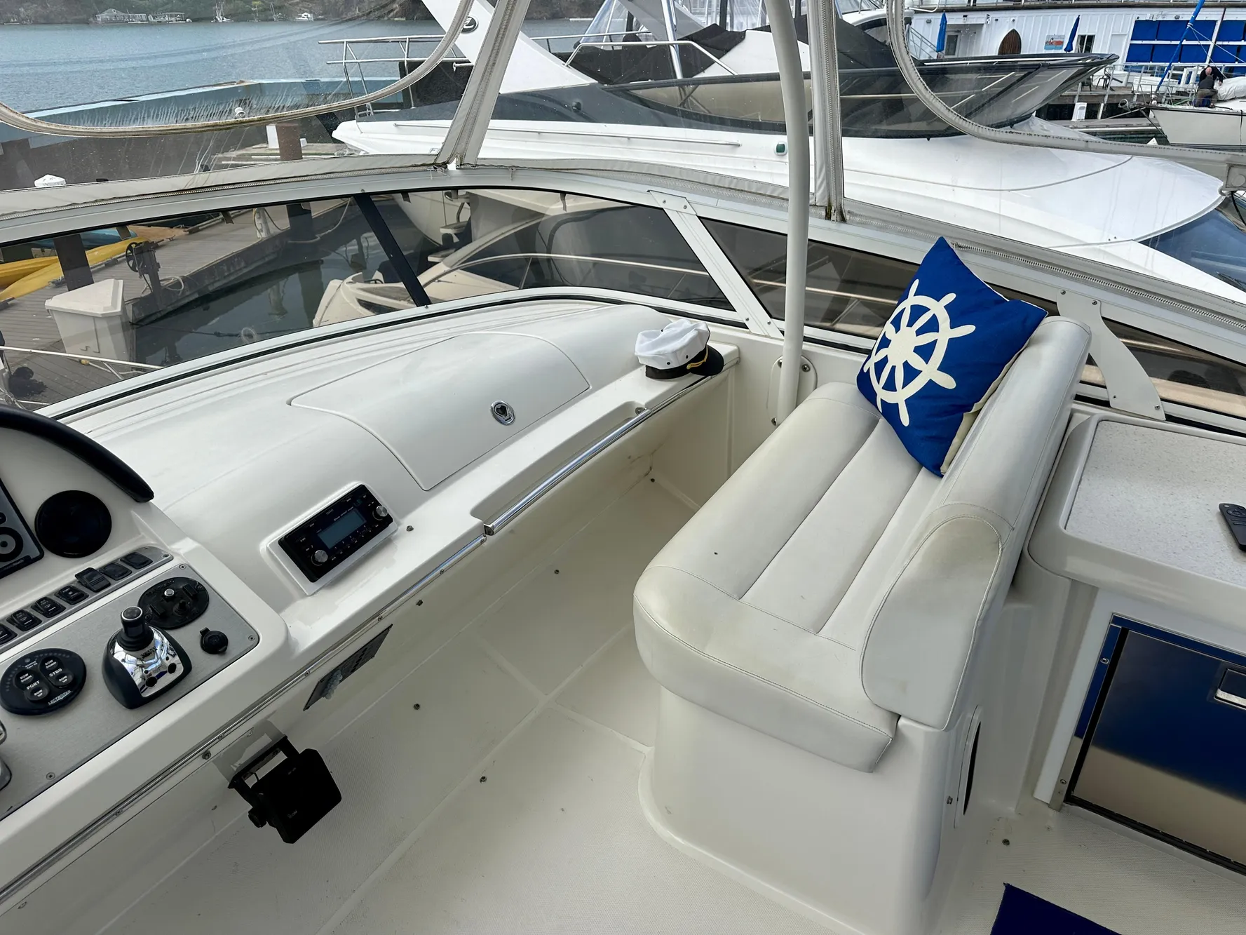 2008 Carver 43 Super Sport yacht cockpit with white seating and nautical-themed decor.
