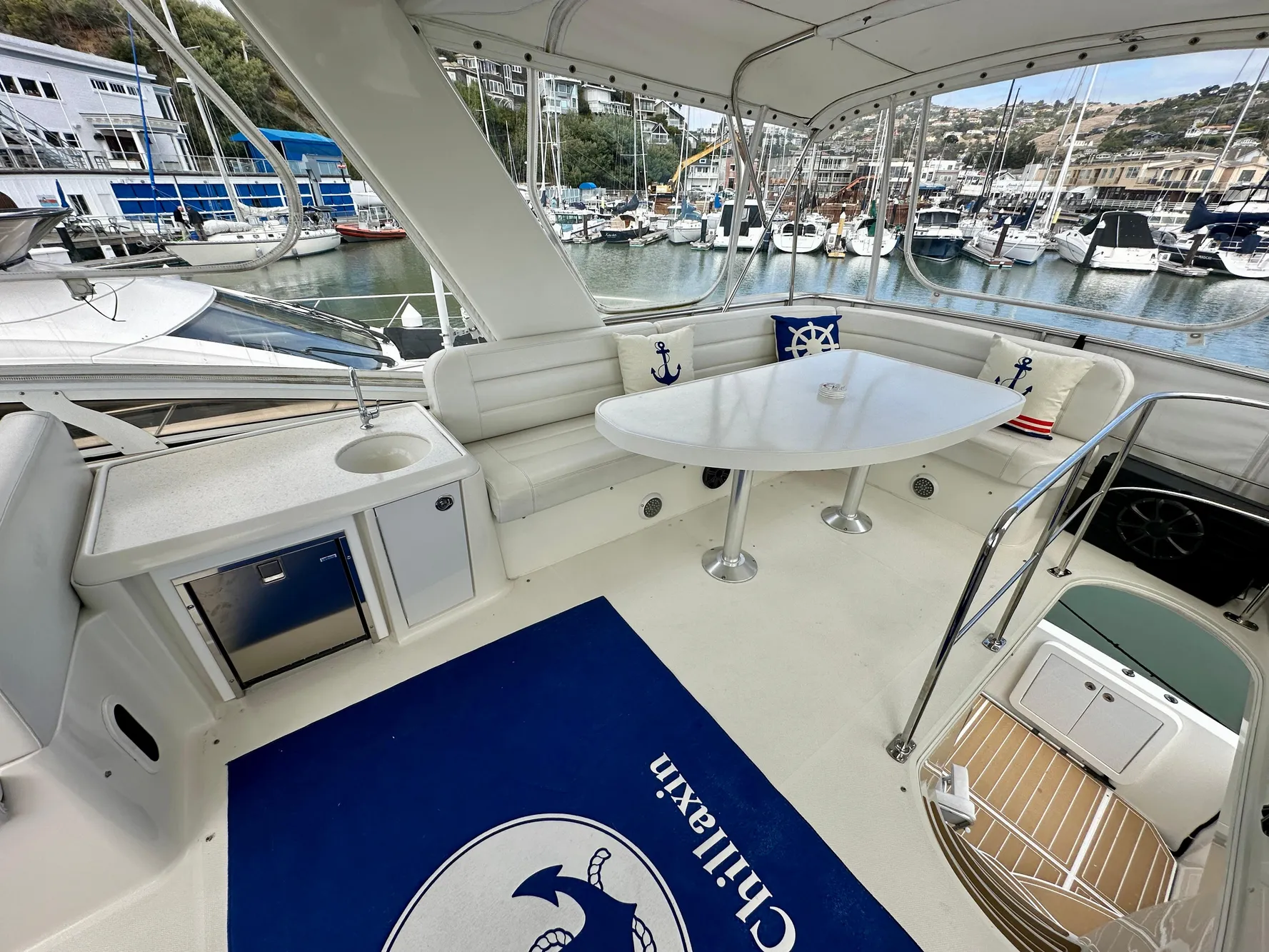 2008 Carver 43 Super Sport yacht with spacious seating and marina view.