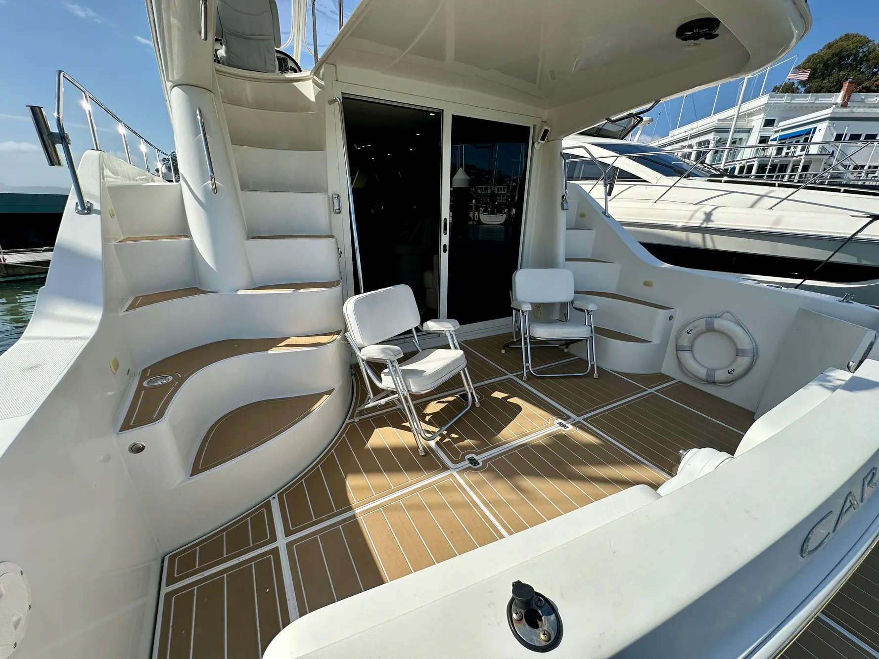 2008 Carver 43 Super Sport yacht deck with seating and stairs.