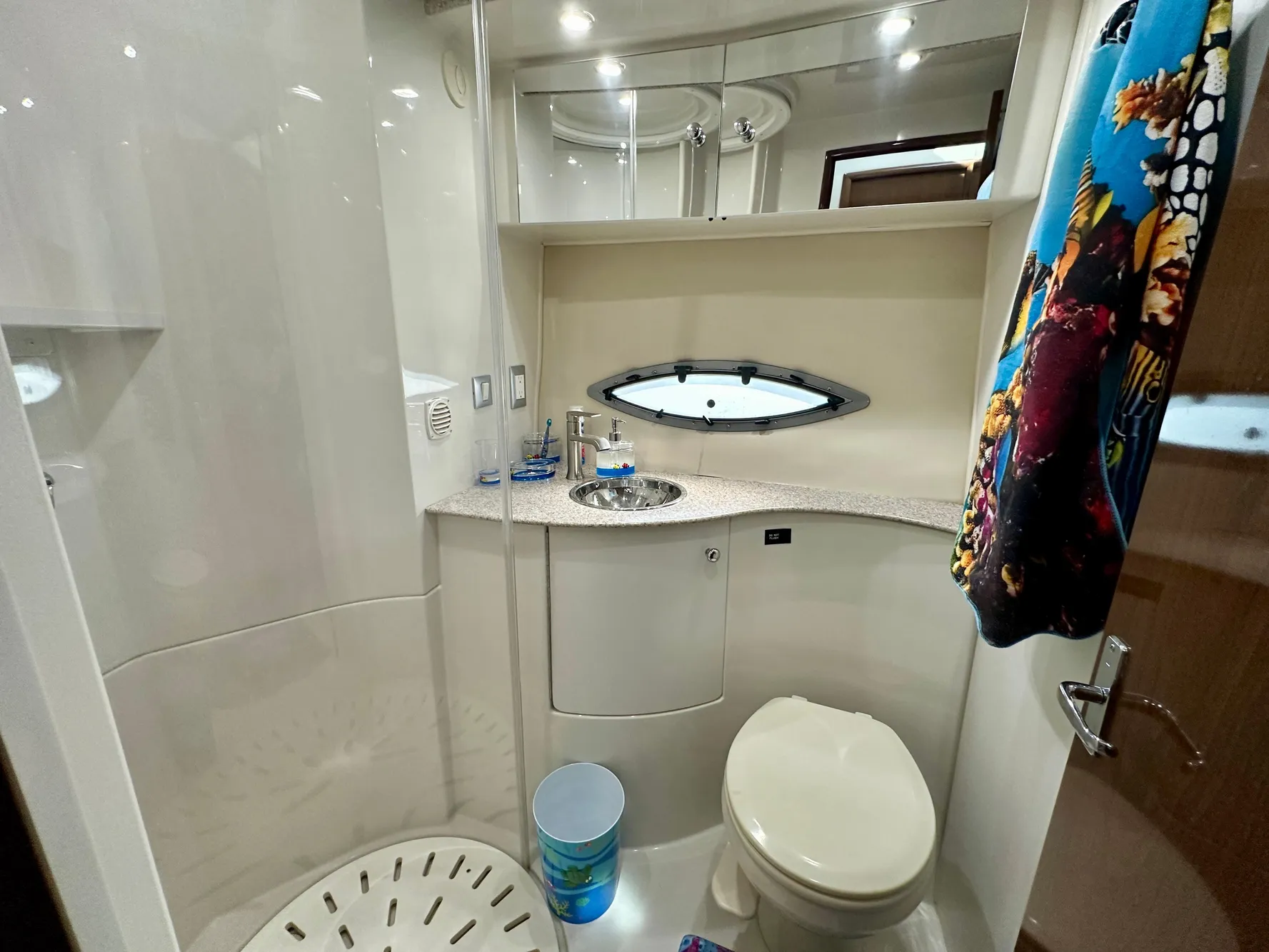 Bathroom interior of 2008 Carver 43 Super Sport yacht, featuring modern fixtures and compact design.