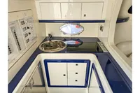 Luxurious 2010 Performance 1107 yacht interior with modern kitchen and sleek design.