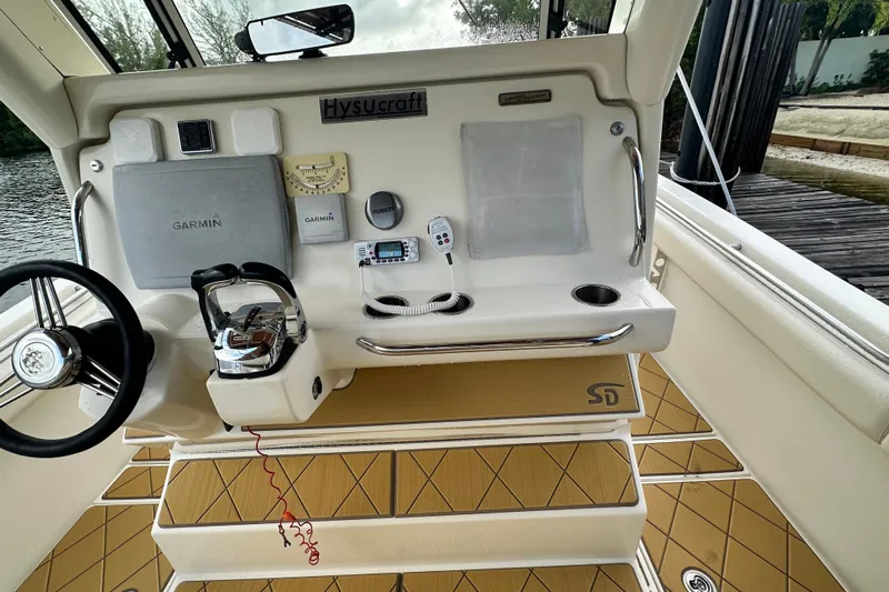  Yacht Photos Pics Helm of 2009 Mamba 350 boat with Garmin navigation system and steering wheel.