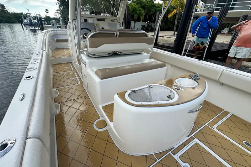  Yacht Photos Pics 2009 Mamba 350 boat interior with seating, sink, and deck details.