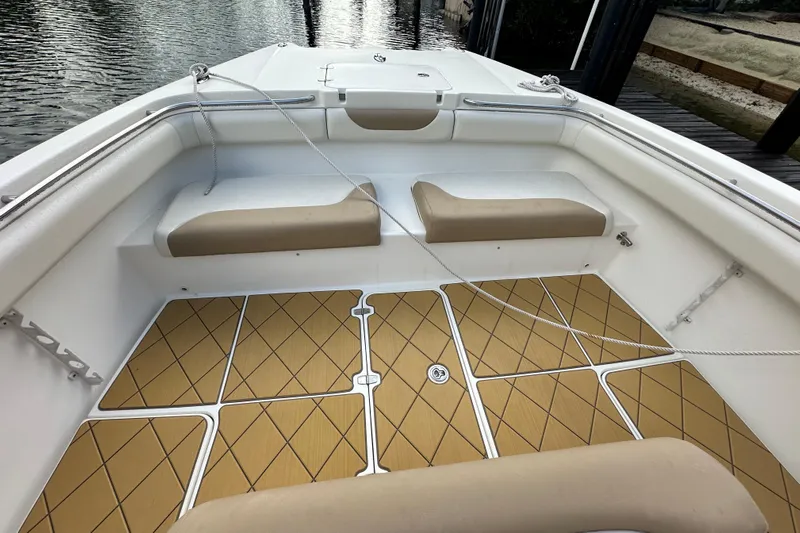  Yacht Photos Pics 2009 Mamba 350 boat interior with tan seating and diamond-patterned flooring.