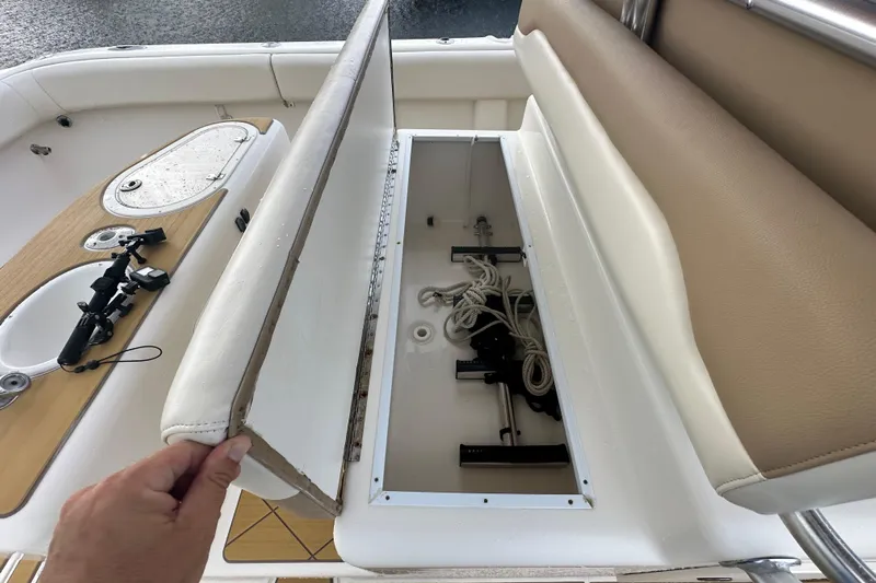  Yacht Photos Pics Open storage compartment on 2009 Mamba 350 boat, revealing ropes and equipment.