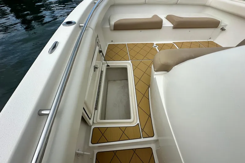  Yacht Photos Pics 2009 Mamba 350 boat interior with open storage compartment and cushioned seating.