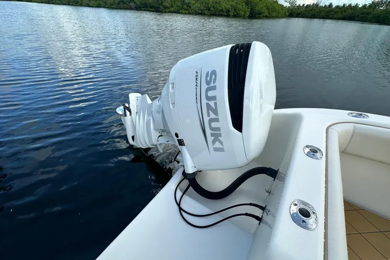  Yacht Photos Pics Boat with Suzuki outboard motor on a calm lake, Mamba 350, 2009 model.