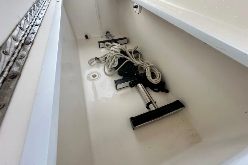  Yacht Photos Pics Storage compartment of 2009 Mamba 350 boat with rope and tools inside.
