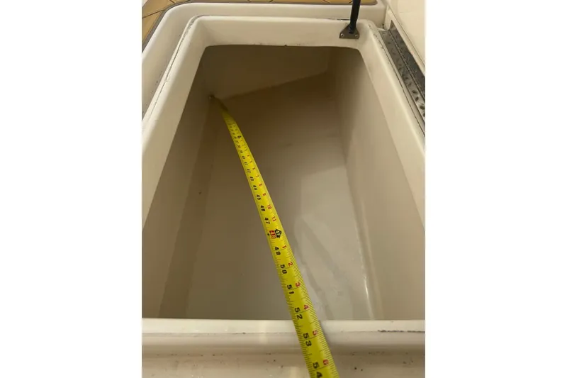  Yacht Photos Pics Open storage compartment with measuring tape inside, Mamba 350, 2009 model.