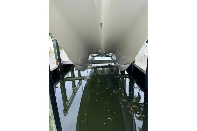  Yacht Photos Pics Underwater view of a 2009 Mamba 350 boat hull in a dock.