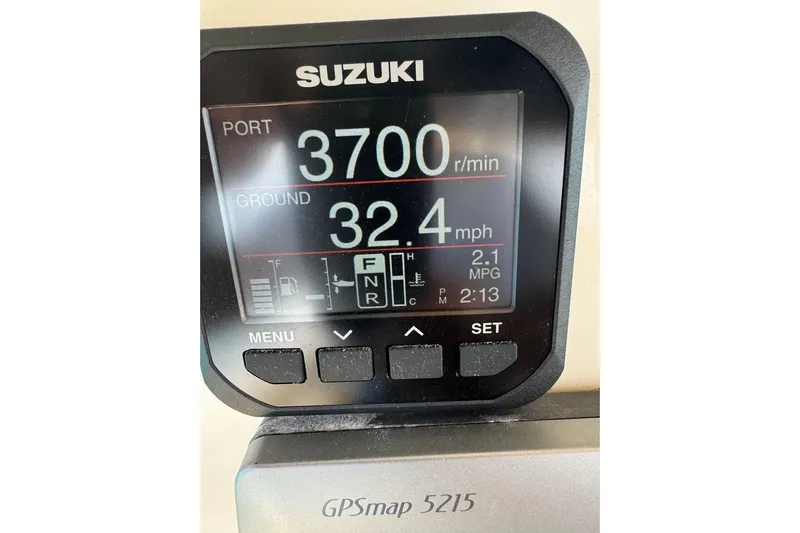  Yacht Photos Pics Suzuki display showing 3700 RPM, 32.4 mph speed, and GPSmap 5215 on Mamba 350, 2009.