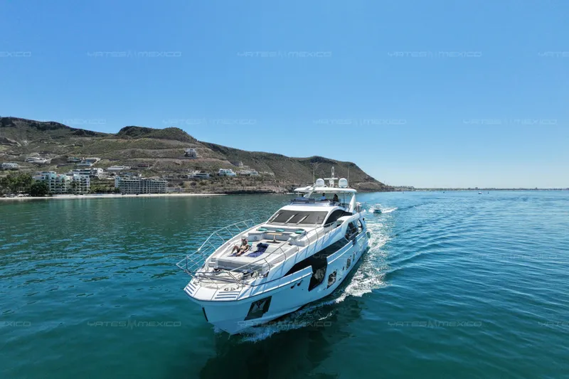 Aleph Yacht Photos Pics Luxurious 2019 Azimut Grande 27M yacht cruising near scenic coastal landscape.