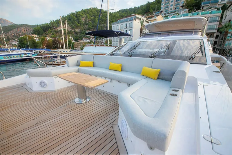 Aleph Yacht Photos Pics Luxurious 2019 Azimut Grande 27M yacht deck with elegant seating and scenic marina view.