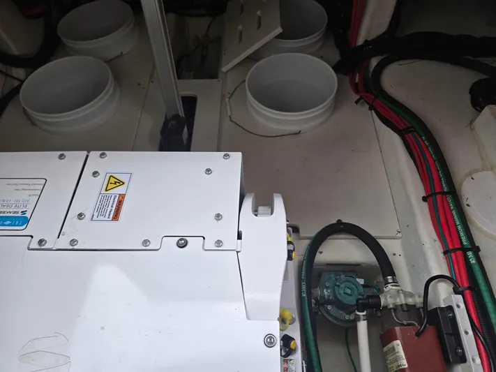 Live It Up Yacht Photos Pics Engine compartment of 2020 Four Winns V355FX OB boat, showing mechanical components and wiring.