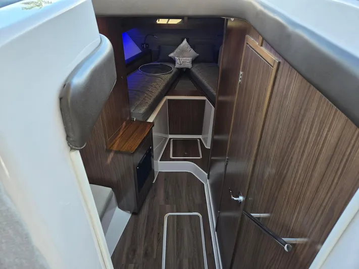 Live It Up Yacht Photos Pics 2020 Four Winns V355FX OB cabin interior with wood finish and modern design.