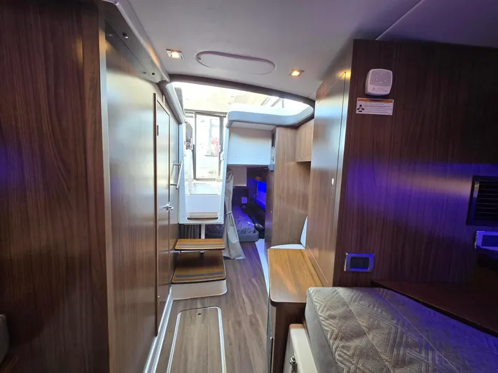 Live It Up Yacht Photos Pics Interior of 2020 Four Winns V355FX OB boat with modern wood finish and ambient lighting.