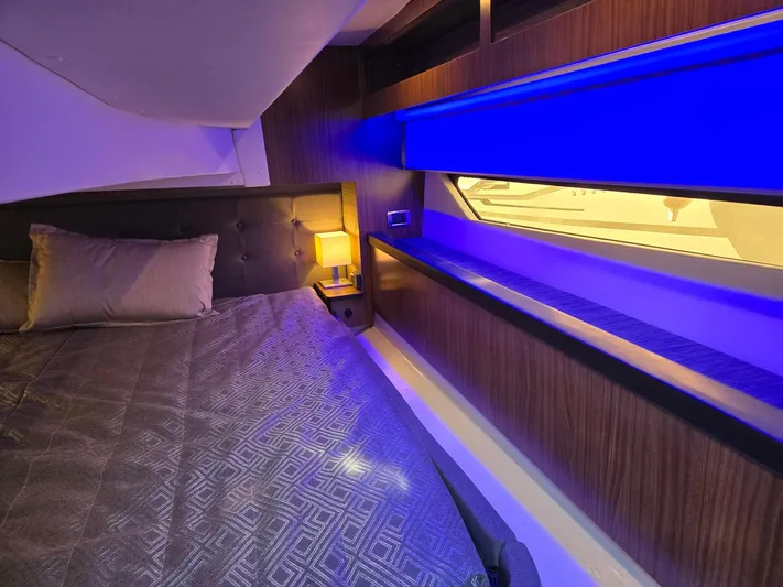 Live It Up Yacht Photos Pics 2020 Four Winns V355FX OB cabin interior with modern lighting and cozy bedding.
