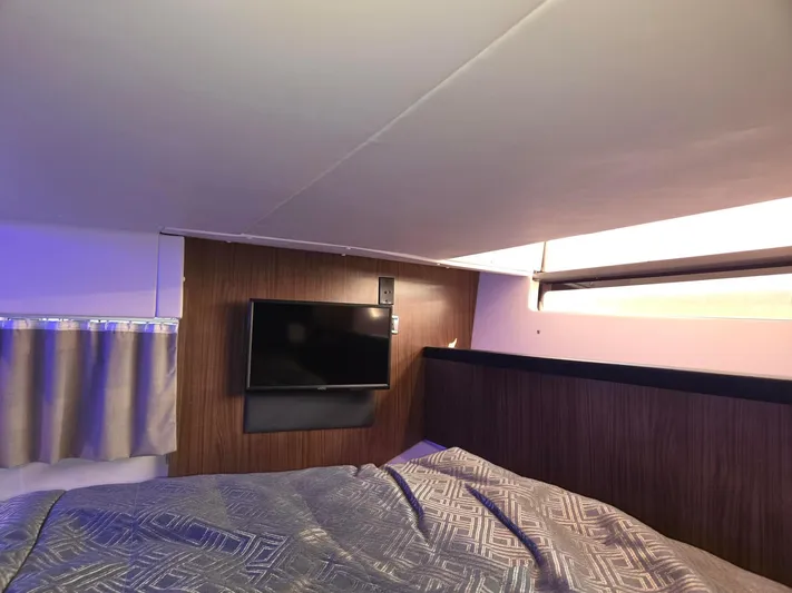 Live It Up Yacht Photos Pics Interior cabin of 2020 Four Winns V355FX OB with TV and bed.