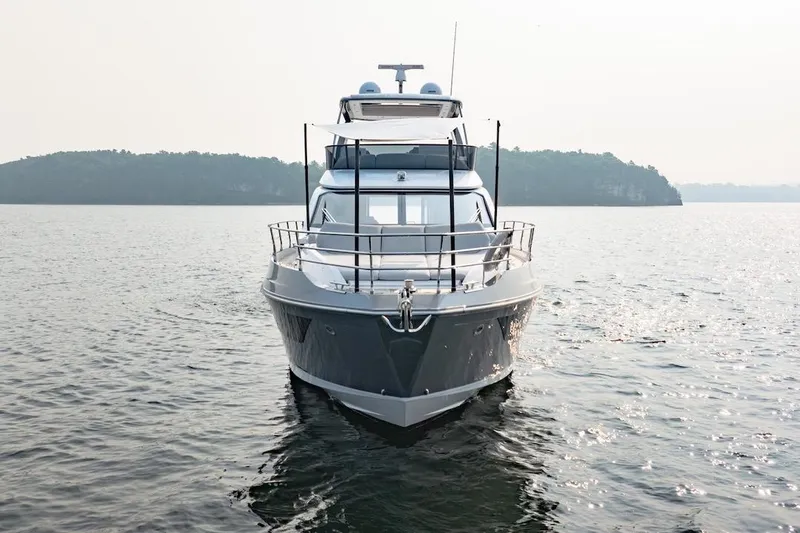  Yacht Photos Pics 2023 Azimut Fly 53 yacht on calm water with scenic island backdrop.
