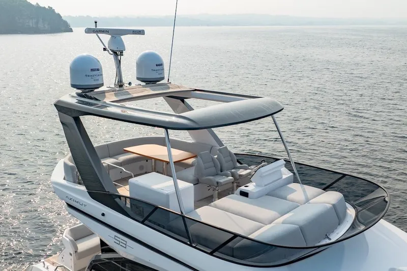  Yacht Photos Pics 2023 Azimut Fly 53 yacht with sleek design and luxurious seating on open water.