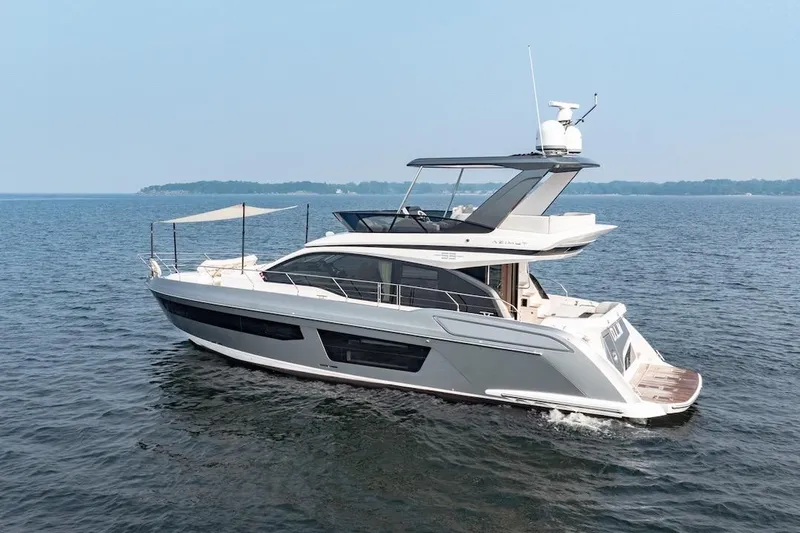  Yacht Photos Pics 2023 Azimut Fly 53 yacht cruising on open water, showcasing sleek design and luxury features.
