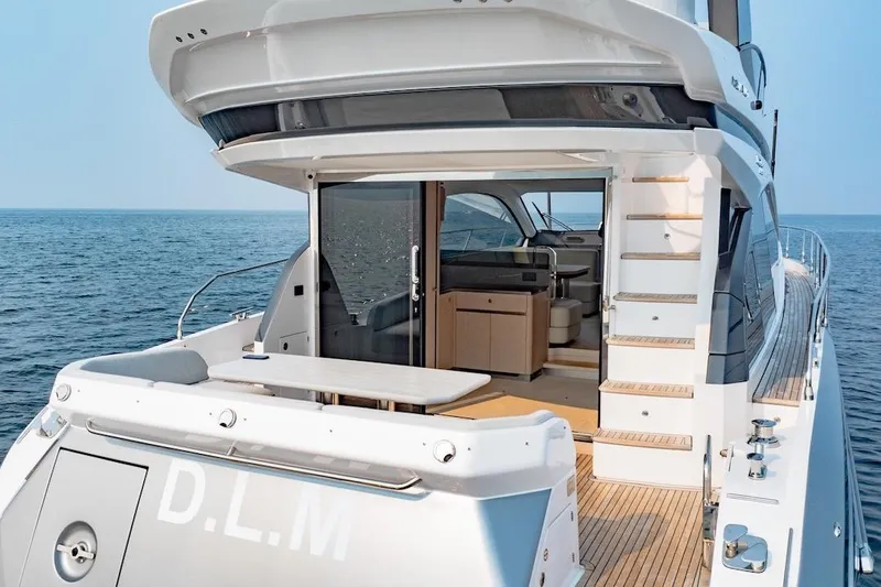  Yacht Photos Pics 2023 Azimut Fly 53 yacht with open deck and luxurious interior on the ocean.