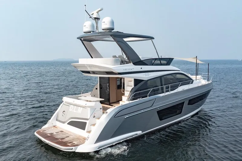  Yacht Photos Pics 2023 Azimut Fly 53 yacht cruising on open water, showcasing sleek design and luxury features.