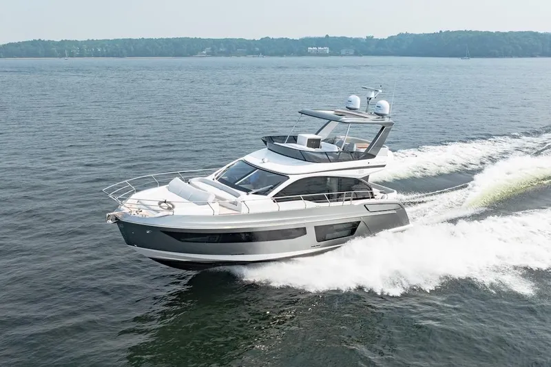  Yacht Photos Pics 2023 Azimut Fly 53 yacht cruising on open water, showcasing sleek design and luxury features.