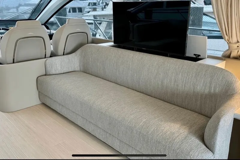  Yacht Photos Pics Luxurious interior of 2023 Azimut Fly 53 yacht with modern sofa and helm seats.