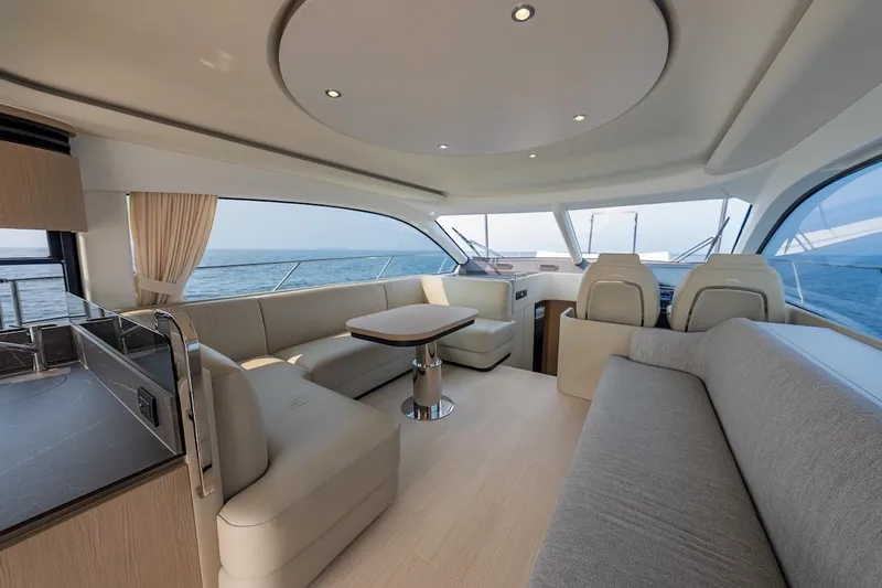  Yacht Photos Pics Luxurious interior of 2023 Azimut Fly 53 yacht with elegant seating and ocean view.
