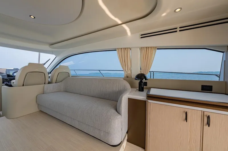  Yacht Photos Pics Interior of 2023 Azimut Fly 53 yacht with modern seating and ocean view.