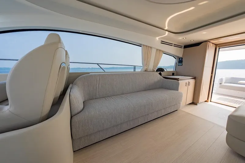  Yacht Photos Pics Luxurious interior of 2023 Azimut Fly 53 yacht with elegant seating and panoramic windows.