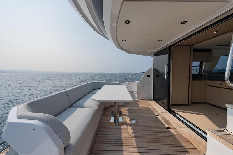  Yacht Photos Pics Luxurious 2023 Azimut Fly 53 yacht deck with ocean view and elegant seating area.