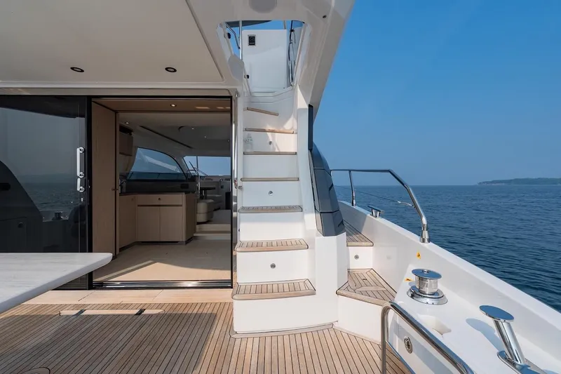  Yacht Photos Pics 2023 Azimut Fly 53 yacht interior with stairs, ocean view, and modern design.