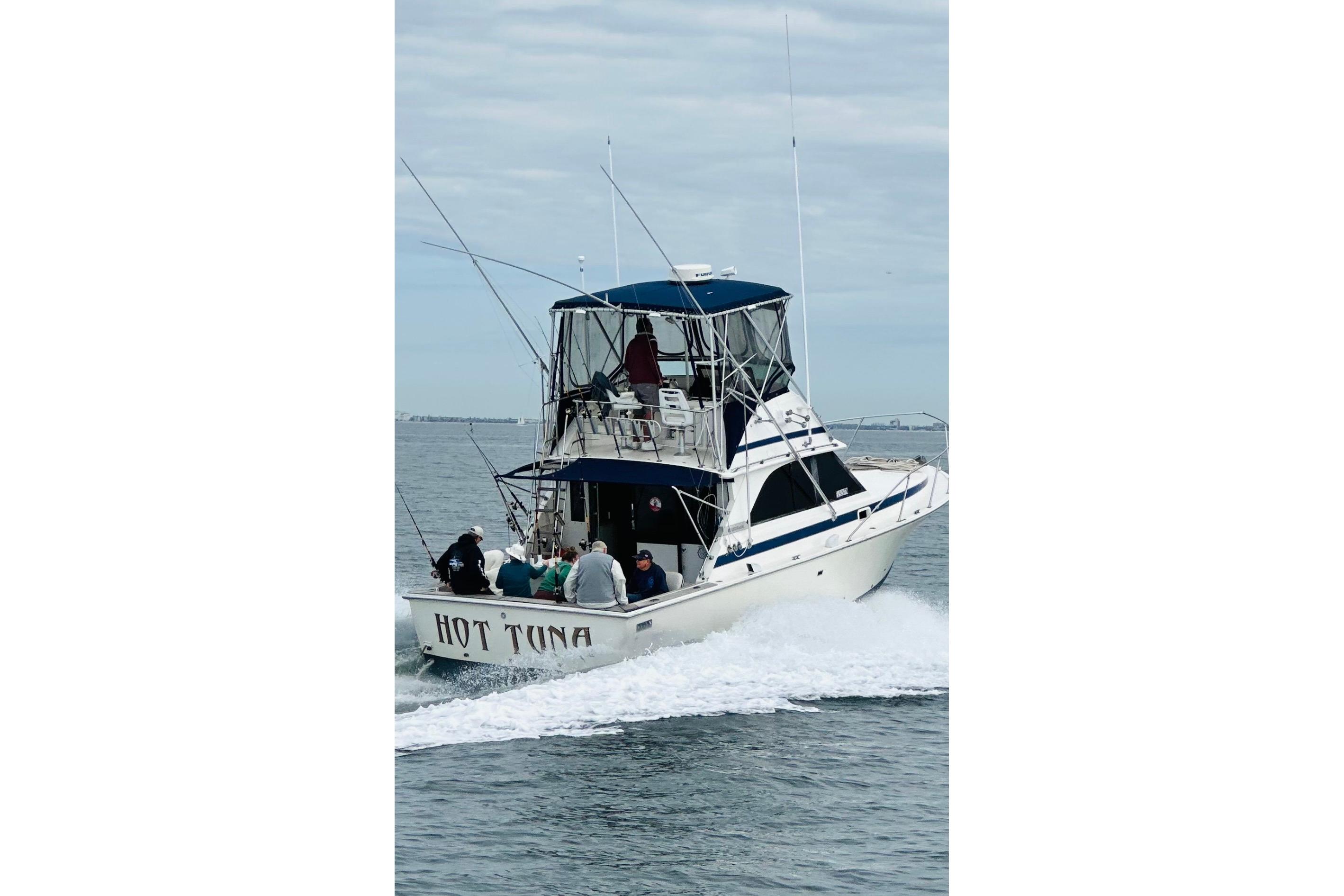 1981 Bertram 35 Sportfish boat "Hot Tuna" cruising on open water.