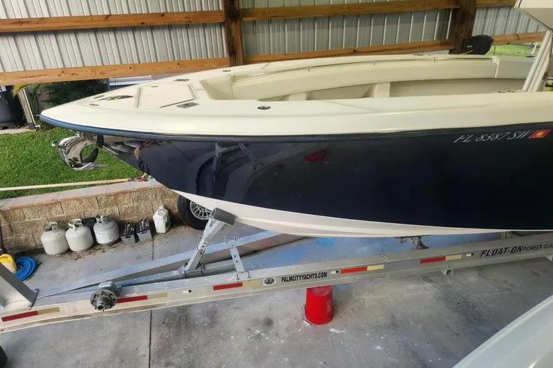  Yacht Photos Pics 2009 Invincible 36 Open Fisherman boat on trailer in covered storage.