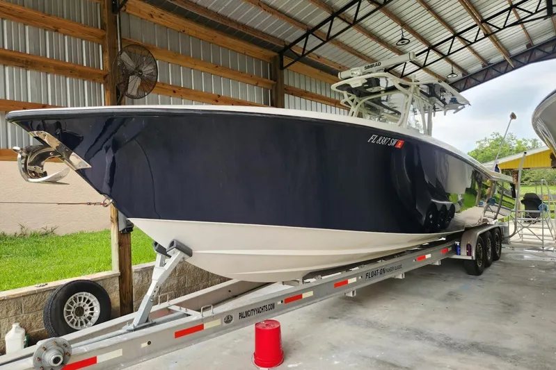  Yacht Photos Pics 2009 Invincible 36 Open Fisherman boat on trailer in covered storage.