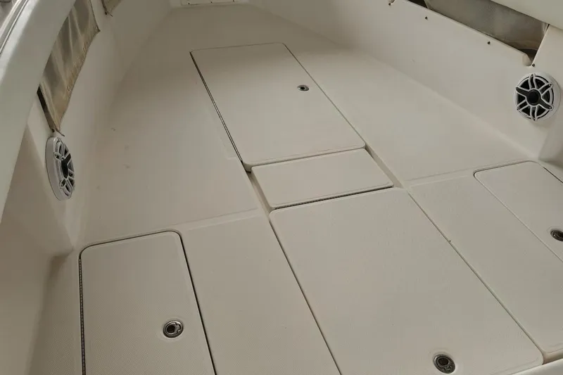  Yacht Photos Pics 2009 Invincible 36 Open Fisherman boat deck with storage compartments and speakers.