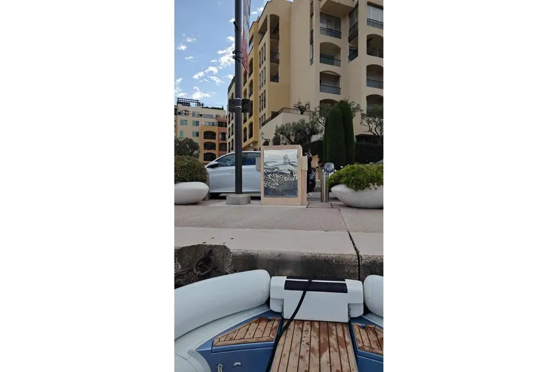 Zig Zag Ocean Yacht Photos Pics Docked yacht with artwork, modern buildings, and greenery in the background. Admiral 45 METERS, 2014.