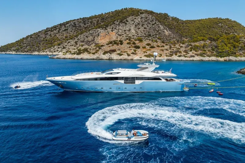 Zig Zag Ocean Yacht Photos Pics Luxurious 2014 Admiral 45 Meters yacht cruising in scenic blue waters near a rocky coastline.