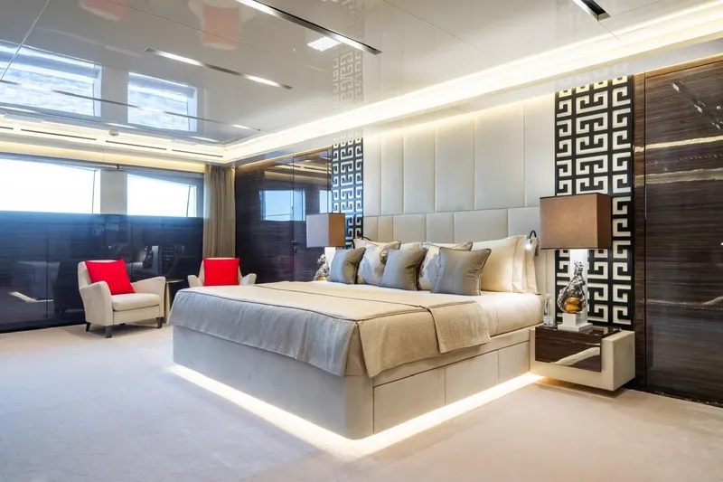 Zig Zag Ocean Yacht Photos Pics Luxurious yacht bedroom interior with elegant decor, featuring a large bed and modern furnishings, Admiral 45 Meters.