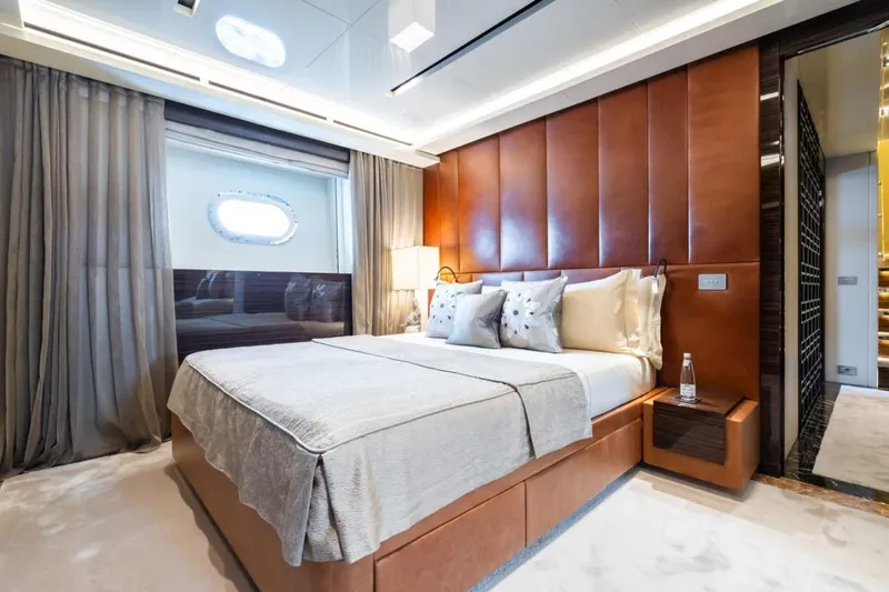 Zig Zag Ocean Yacht Photos Pics Luxurious bedroom interior on 2014 Admiral 45 Meters yacht, featuring elegant design and plush bedding.