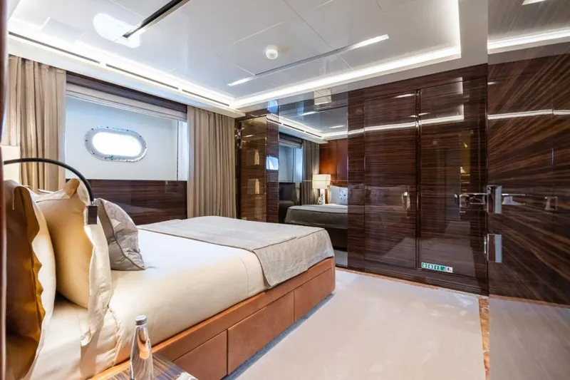 Zig Zag Ocean Yacht Photos Pics Luxurious bedroom interior on 2014 Admiral 45 METERS yacht, featuring elegant wood finishes.
