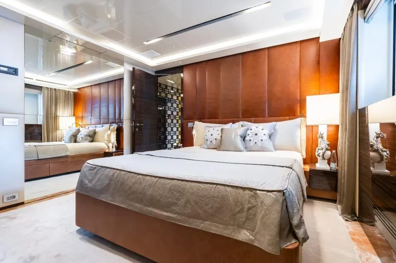 Zig Zag Ocean Yacht Photos Pics Luxurious bedroom interior on 2014 Admiral 45 METERS yacht, featuring elegant decor and plush bedding.