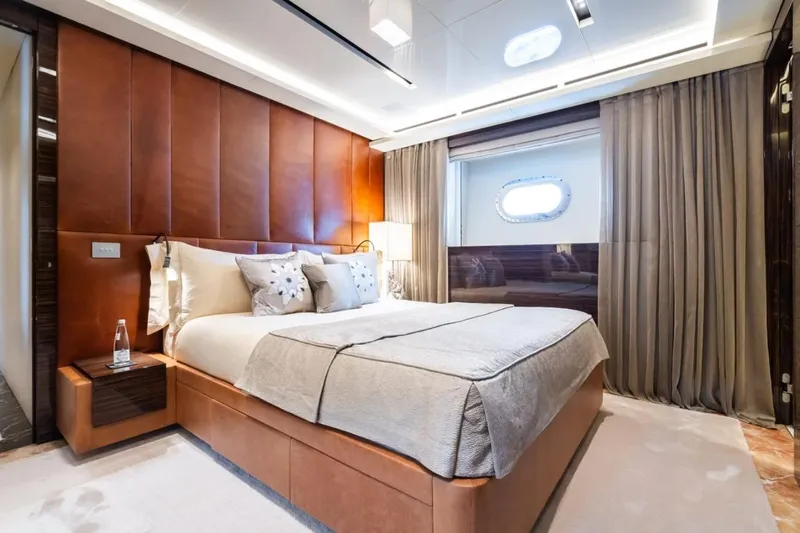Zig Zag Ocean Yacht Photos Pics Luxurious bedroom interior on 2014 Admiral 45 Meters yacht, featuring elegant design and cozy ambiance.