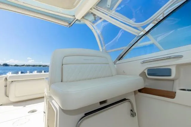  Yacht Photos Pics 2017 Grady-White Freedom 307 boat interior with white seating and ocean view.